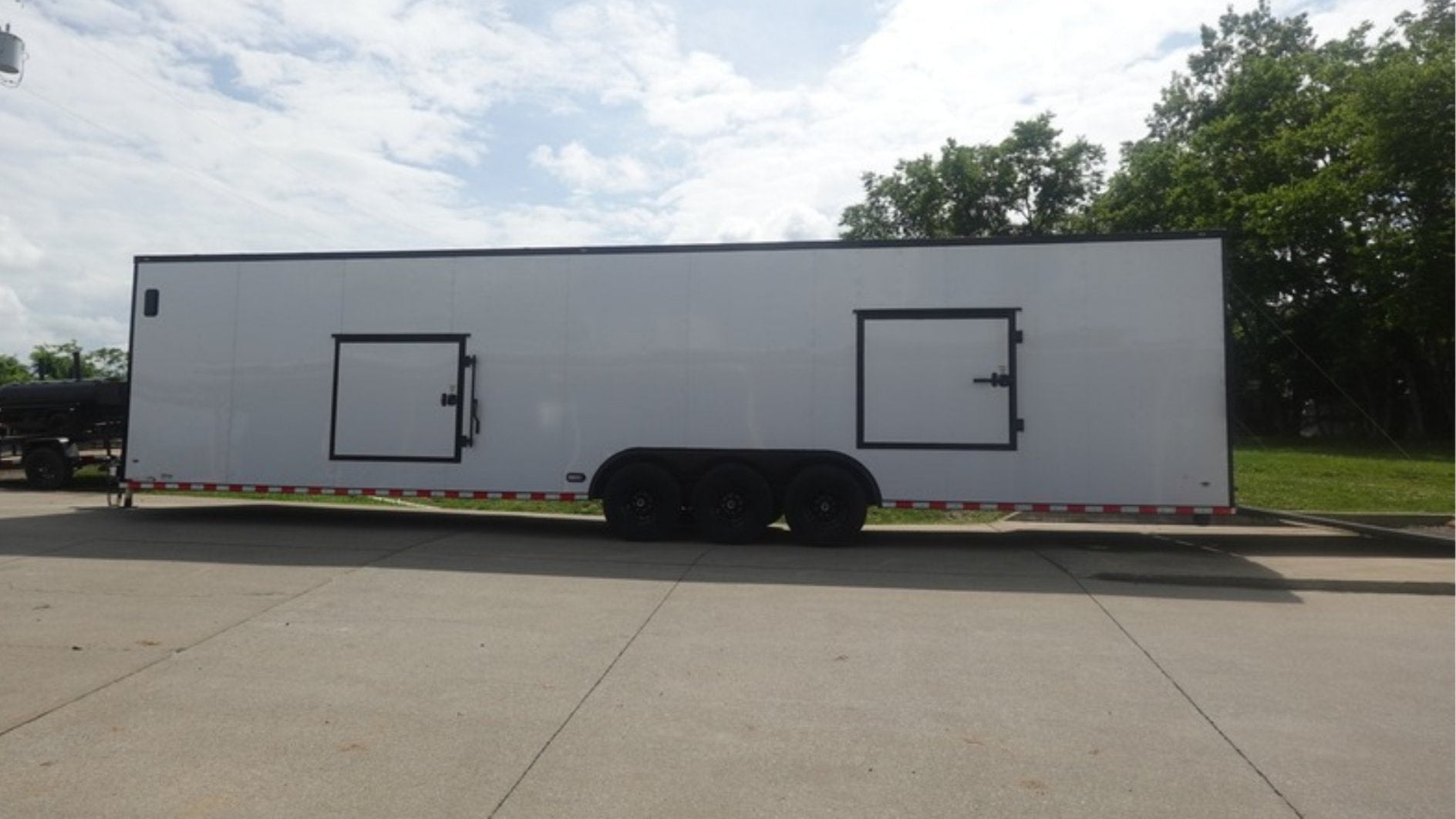 8.5X36 White With Black Out Enclosed Trailer With Escape Doors E Track Floor (3) 7K Axles 21K GVWR - Image 7